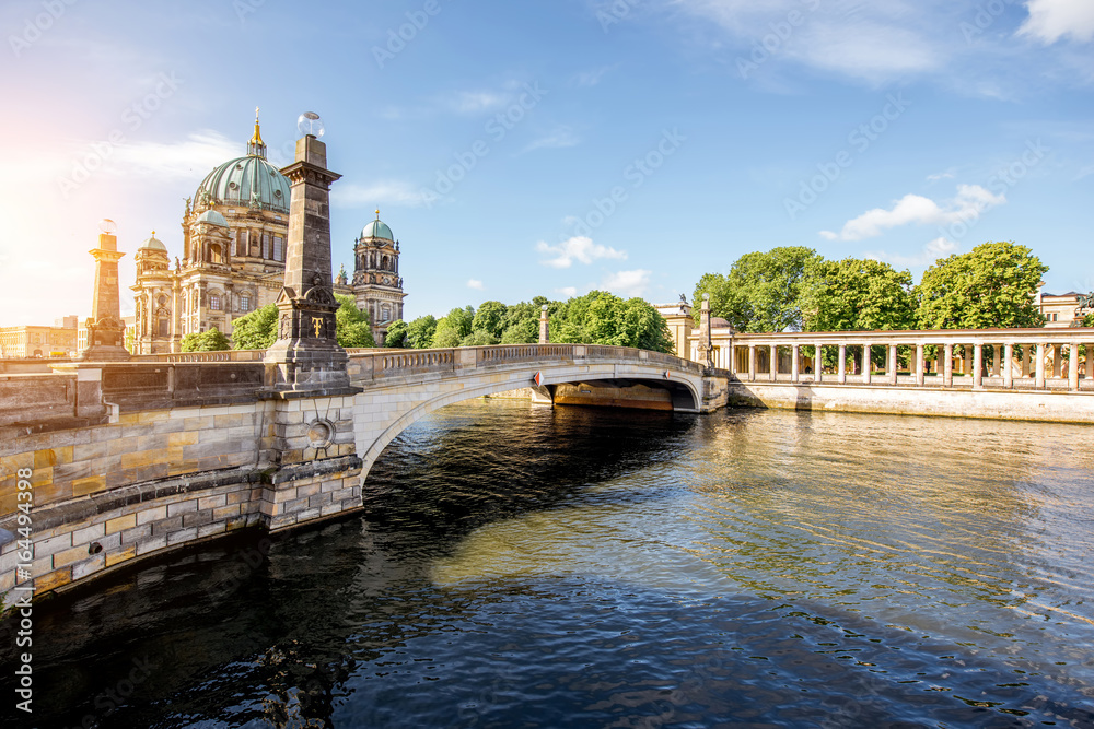 Sunrise view on the riverside with Dom cathedral and bridge in the old town of Berlin city