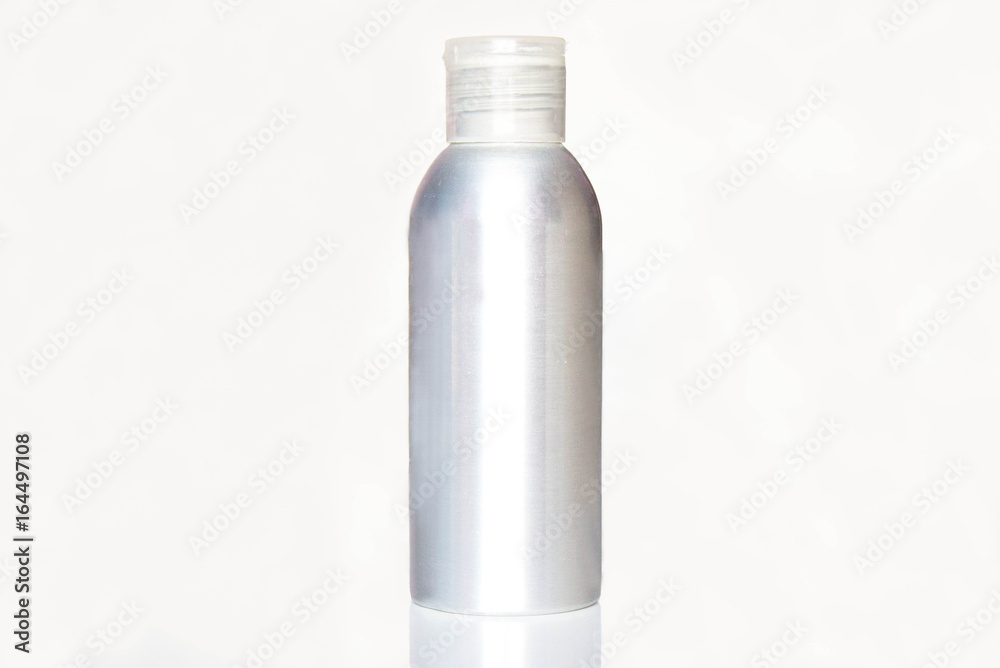 Aluminum metal empty bottle with plastic screw cap. Medicine or cosmetic clear package. Isolated on white background. Aluminum metal empty bottle with plastic screw cap. Medicine or cosmetic clear package. Isolated on white background.