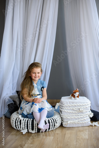 Happy Little child girl at home