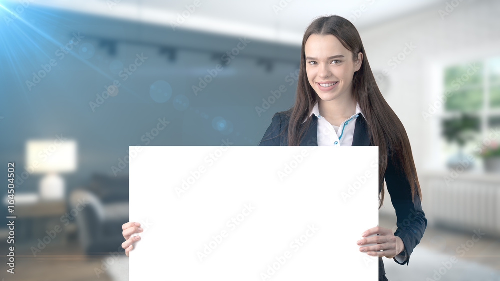 Young beautiful business woman and creative designer standing over blured interior background Young beautiful business woman and creative designer standing over blured interior background