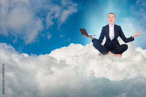 Businesswoman working in the sky and meditating