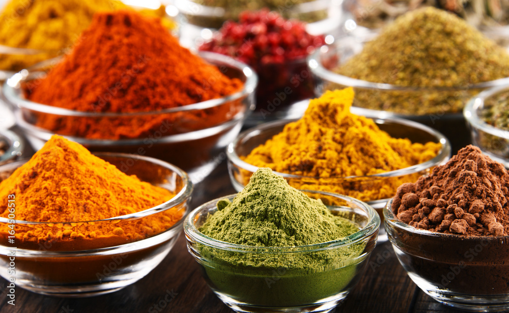 Variety of spices and herbs on kitchen table