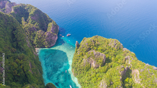 Aerial drone view of iconic tropical turquoise water Pileh Lagoon surrounded by limestone cliffs, Phi Phi islands, Thailand © stryjek