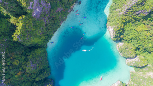 Fototapeta Naklejka Na Ścianę i Meble -  Aerial drone view of iconic tropical turquoise water Pileh Lagoon surrounded by limestone cliffs, Phi Phi islands, Thailand