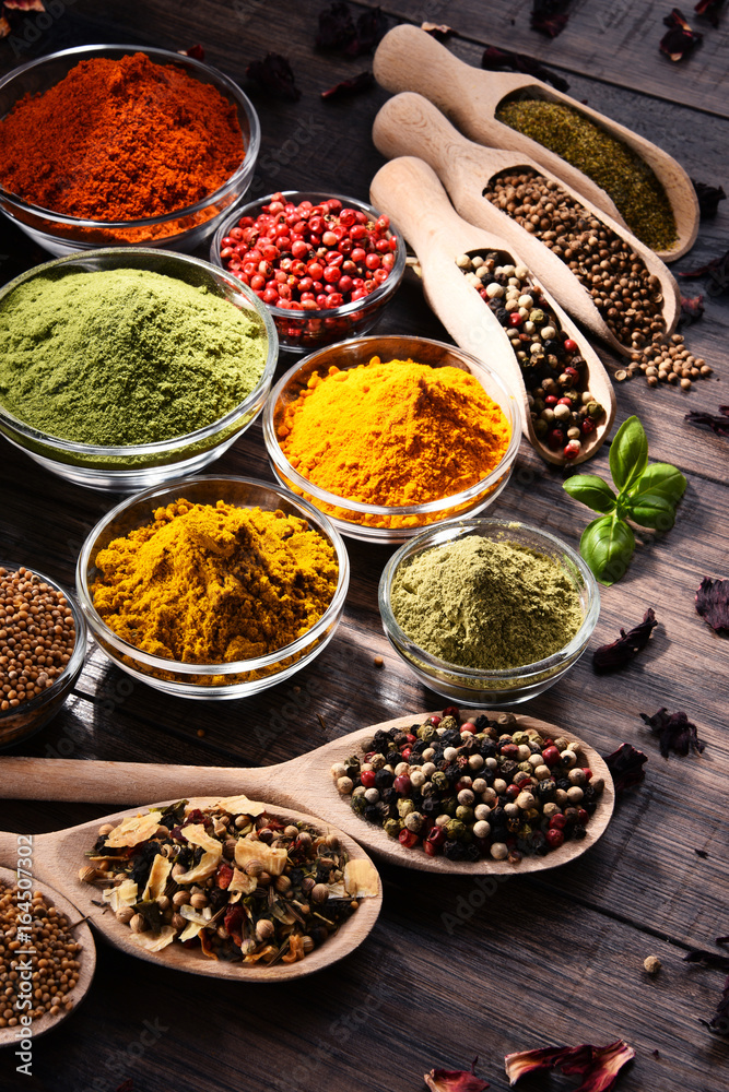 Variety of spices and herbs on kitchen table