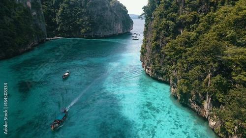 Aerial drone view of iconic tropical turquoise water Pileh Lagoon surrounded by limestone cliffs, Phi Phi islands, Thailand