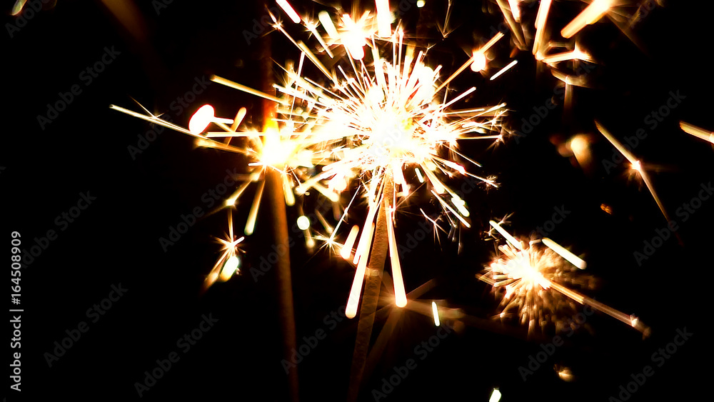 Burning Sparklers in blurred motion. Christmas New Year and Independence Day celebration lights. Burning Sparklers in blurred motion. Christmas New Year and Independence Day celebration lights.