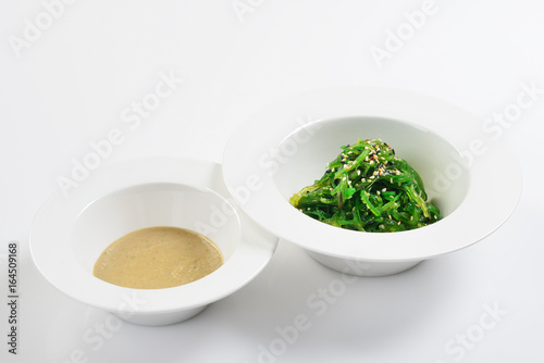 Chukka from pickled seaweed with nut sauce. Asian cuisine.