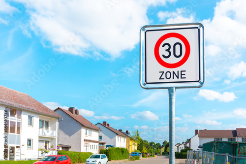 Speed limit sign to 30 in the suburbs