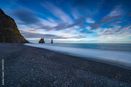 Reynishverfisvegur, Reynisfjara black sand beach near Vik village, Iceland photo