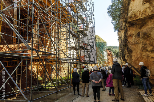 tourists visiting the excavations in the archaeological Atapuerca deposit in Burgos, Spain.