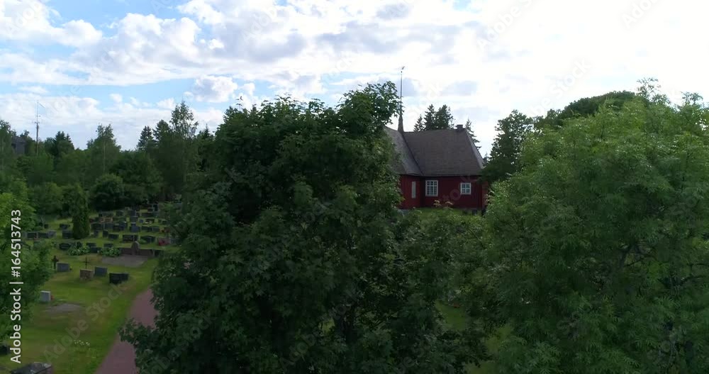 Houtskari church, Cinema 4k aerial rising view near a old church, on houtskar island, at a summer evening, in the finnish archipelago of Turku, Finland Houtskari church, Cinema 4k aerial rising view near a old church, on houtskar island, at a summer evening, in the finnish archipelago of Turku, Finland