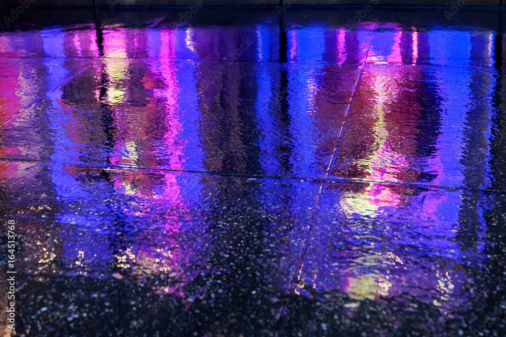 colorful reflections of lights in the rain