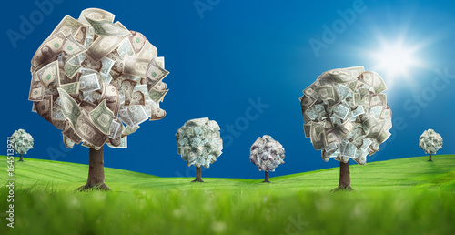 Conceptual image of money tree on green landscape