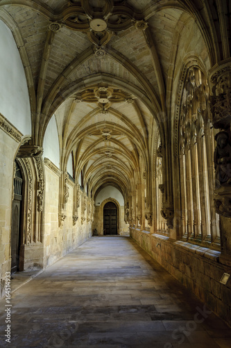 sight of the galleries of the cloister of the monastery of San Salvador in the O  a town in Burgos  Spain.
