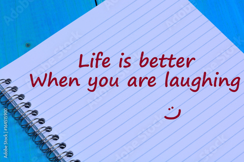 Life is better when you are laughing words on notebook