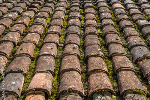 red brick tile roof texture useful as a background © k_samurkas