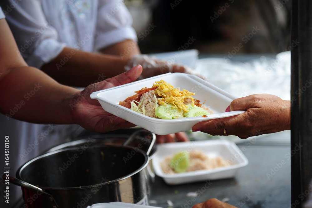 hand give food to hands of a beggar hand give food to hands of a beggar
