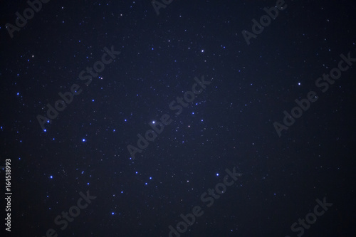 Star in night sky and milky way galaxy. Long exposure photograph.with grain