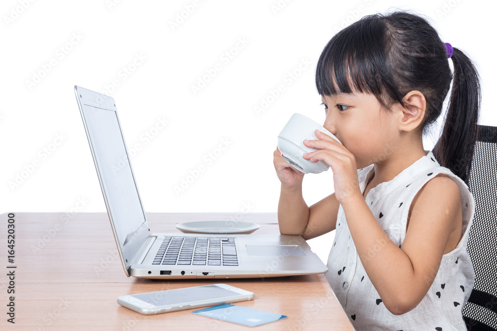 Asian Chinese little girl drinking coffee Asian Chinese little girl drinking coffee