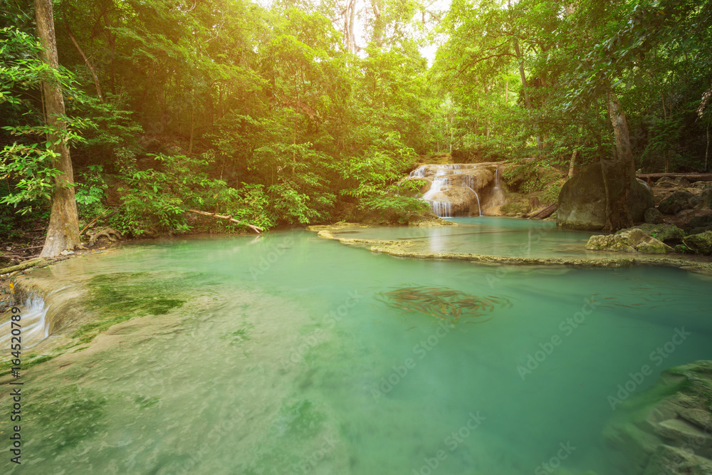 Naklejka premium Level 1 of Erawan Waterfall with Neolissochilus stracheyi fish in Kanchanaburi, Thailand