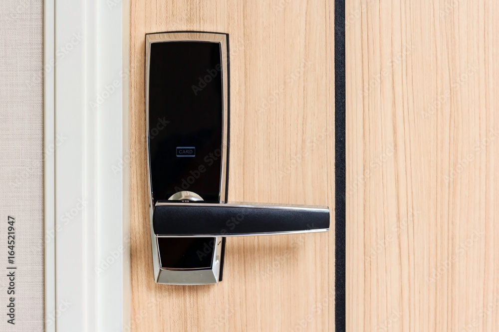 Naklejka premium electronic door lock with card access on wooden door in apartment, safety area for high security