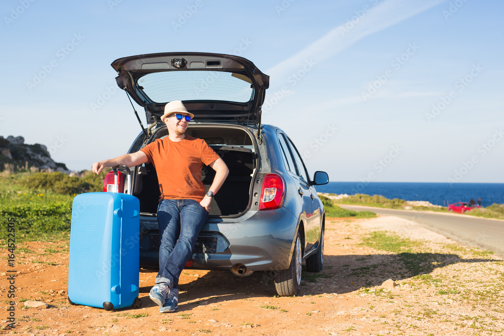 Summer, holiday, trip and vacation concept - Man near the car ready to travel Summer, holiday, trip and vacation concept - Man near the car ready to travel