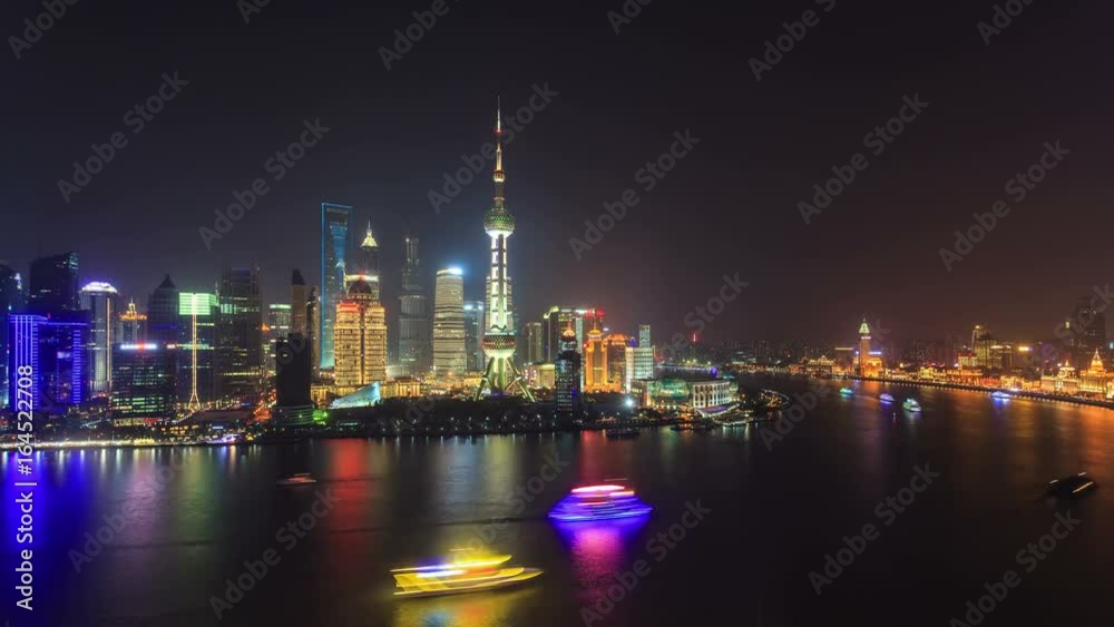Shanghai skyline at night. On the left, Pudong with the Oriental Pearl Tower. On the right, The Bund (Puxi Waitan). Shanghai skyline at night. On the left, Pudong with the Oriental Pearl Tower. On the right, The Bund (Puxi Waitan).