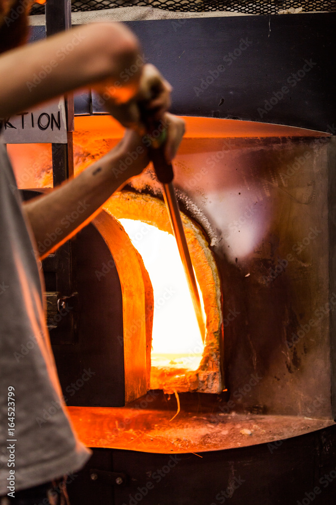 Glassmaker Picking Melted Piece of Glass in the Furnace with Pipe