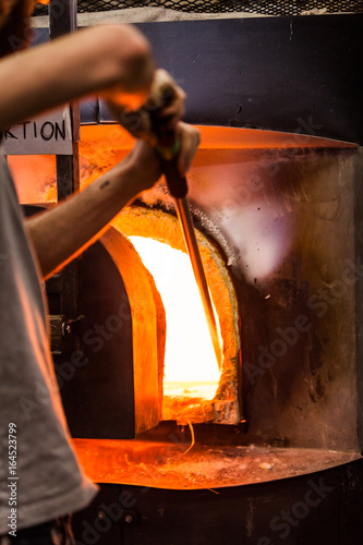 Glassmaker Picking Melted Piece of Glass in the Furnace with Pipe