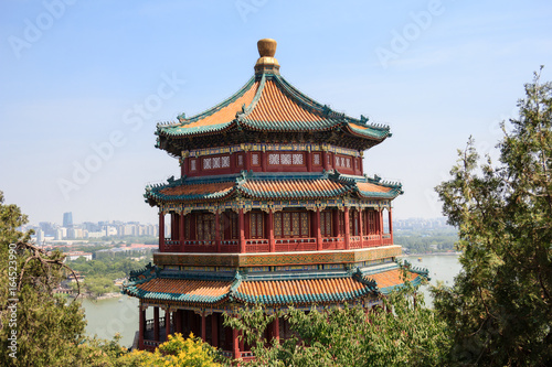 View on Pagoda tower in the Summer Palace imperial park in Beijing, China with the city in the background