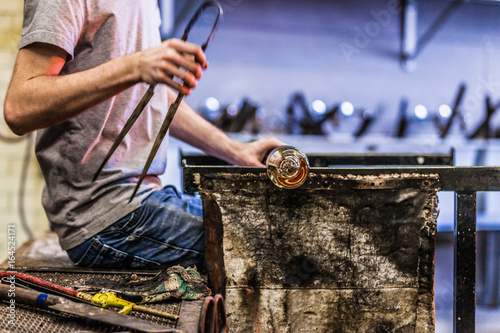 Obraz na plátně Man Hands Closeup Working on a Blown Glass Piece