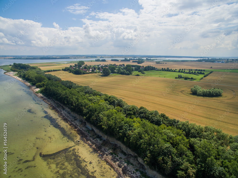 Aerial view of the beautiful beach coastline with cliffs at Poel island, Germany Aerial view of the beautiful beach coastline with cliffs at Poel island, Germany