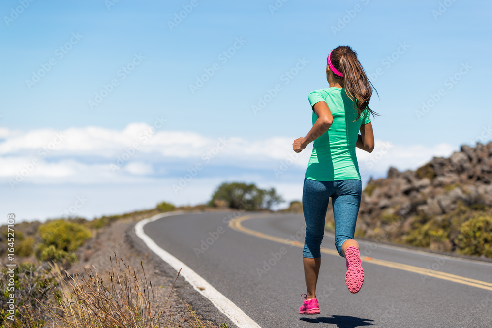 Running runner woman on run goal challenge. Fitness girl training cardio on road to success.