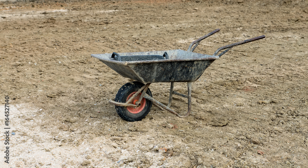 Old Wheelbarrow on the ground. Old Wheelbarrow on the ground.
