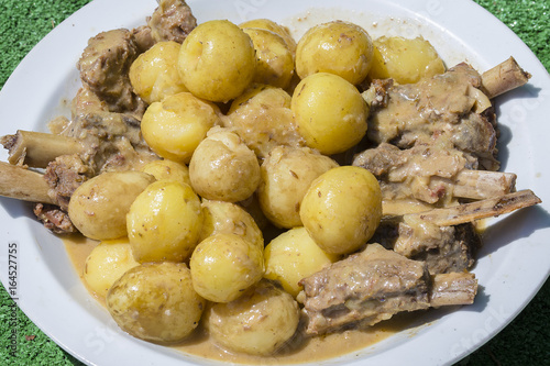 Boiled potatoes with meat in a plate