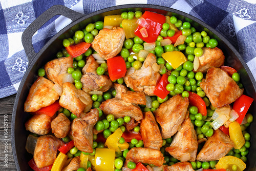 fried meat with green peas, onion, bell peppers