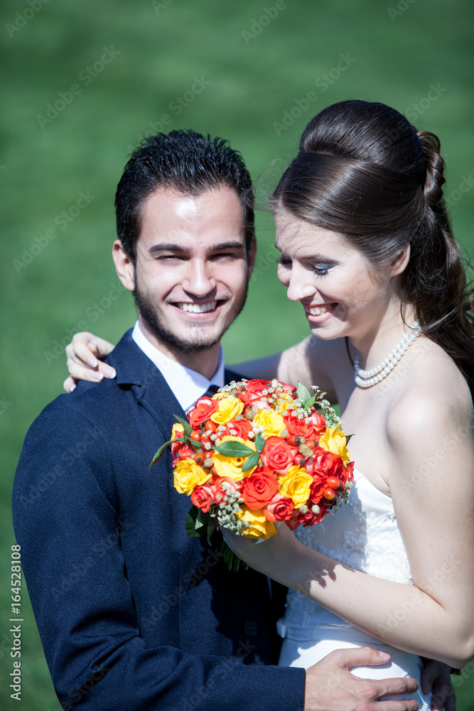 Just married groom and wife posing at camera. Wedding photography Just married groom and wife posing at camera. Wedding photography