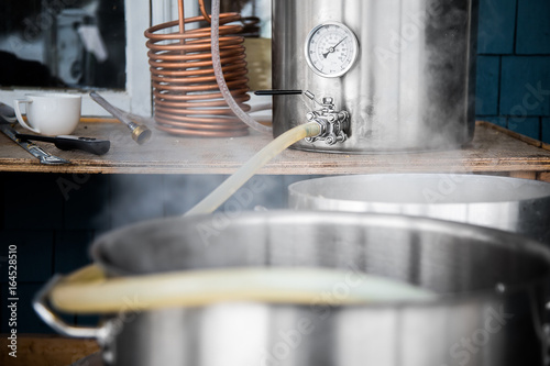 Canvastavla Home Brewing Kit and Pouring Craft Beer Wort into the Boil Kettle