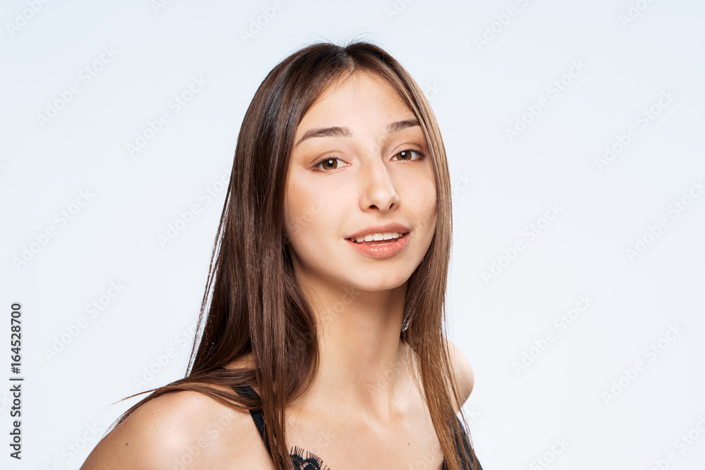 Beautiful young woman on white isolated background, portrait