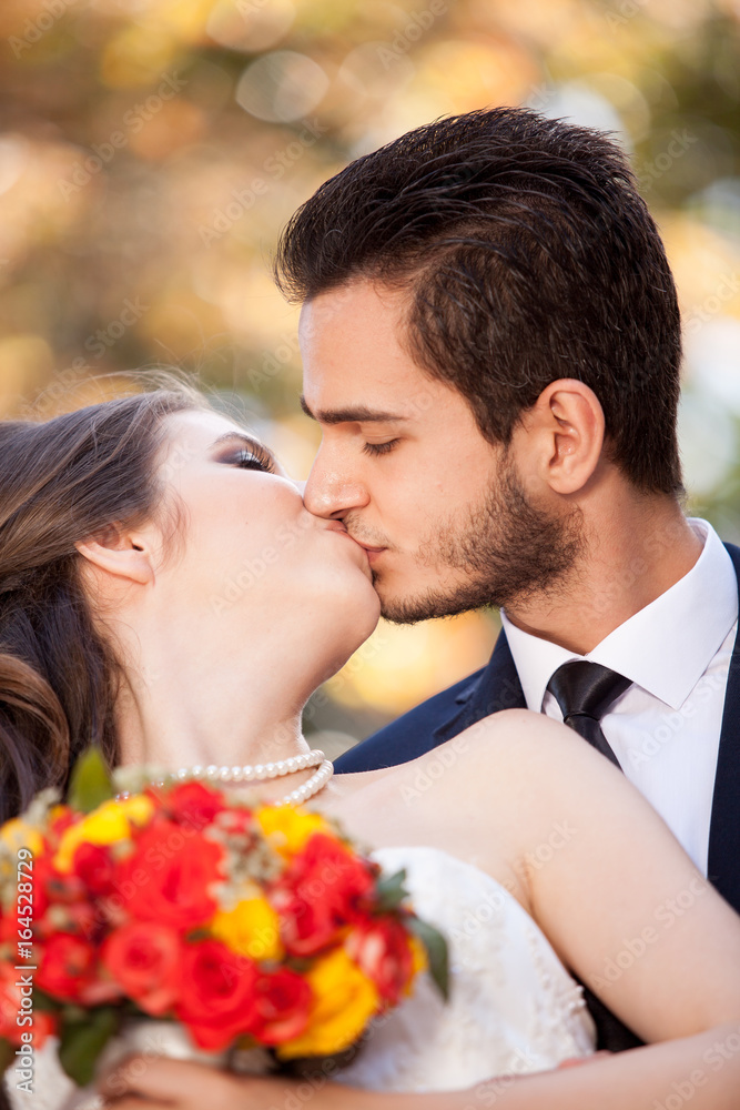 Married young couple posing in wedding photo. Happy people Married young couple posing in wedding photo. Happy people