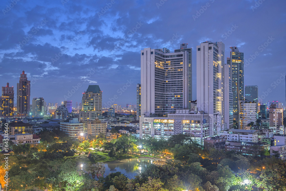 Fototapeta premium Twilight city tower building lights, cityscape downtown background