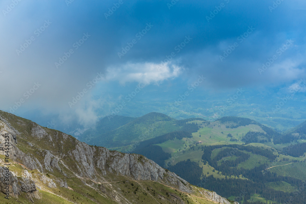 Fototapeta premium Beautiful mountain scenery with limestone rocks and storm clouds, in Piatra Craiului mountain range