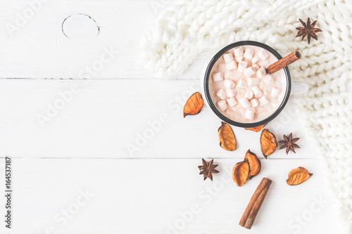 Autumn composition. Hot chocolate, knitted blanket, autumn leaves. Flat lay, top view, close up