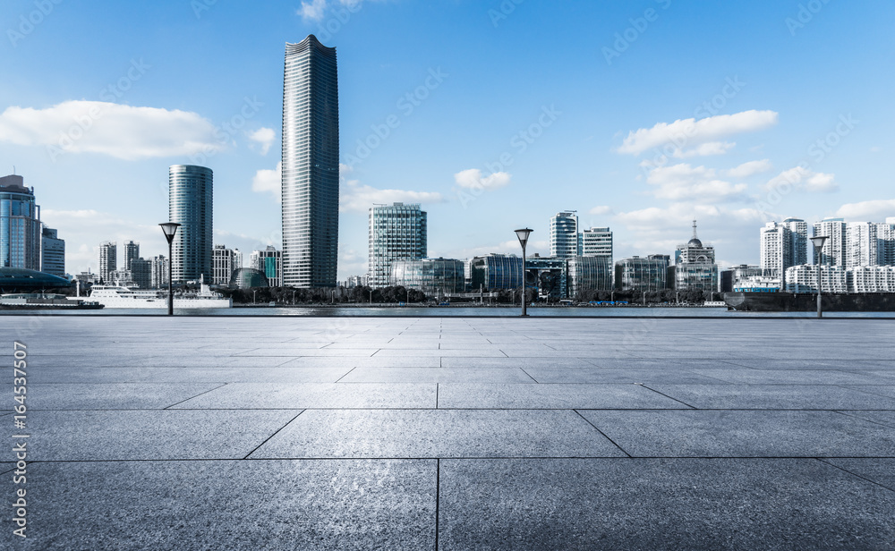 Obraz premium empty brick platform with Shanghai skyline in background.