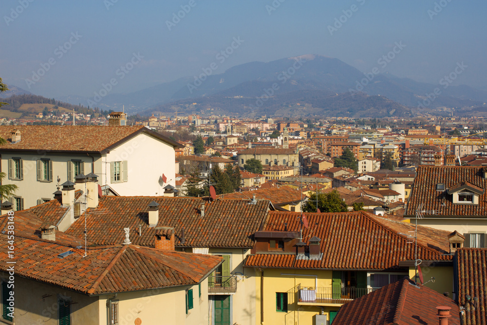 Good area with yellow ochra building, roof tiles roof against sea viewpoint. Europe cover