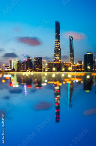Shanghai skyline landmarks of Shanghai with Huangpu river at night in China.