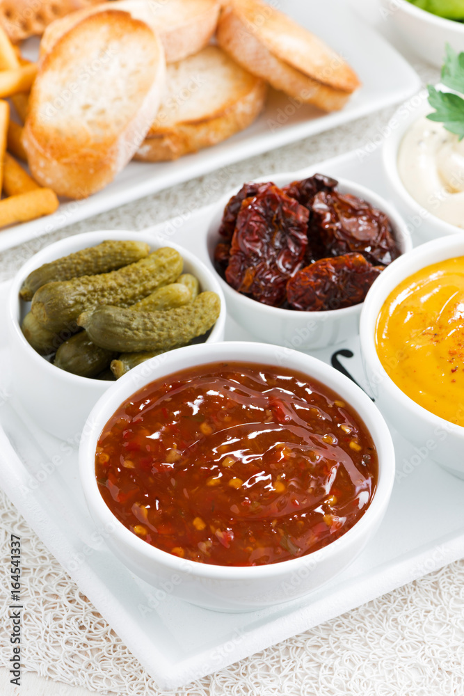sweet and sour tomato sauce and a variety of snacks, vertical sweet and sour tomato sauce and a variety of snacks, vertical