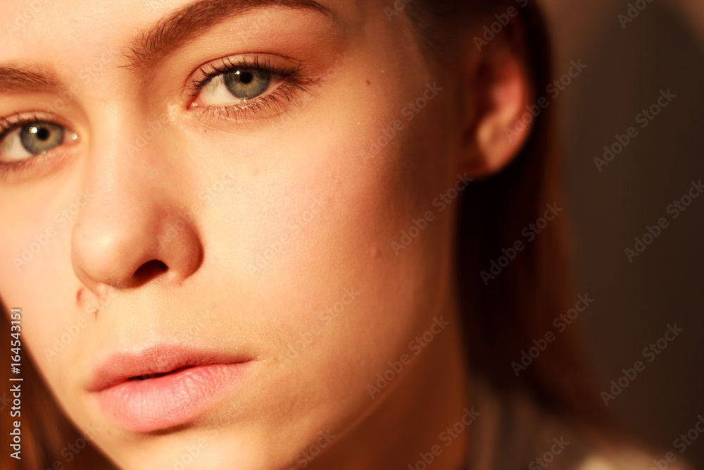 closeup fashion portriat of young model in sunset light closeup fashion portriat of young model in sunset light