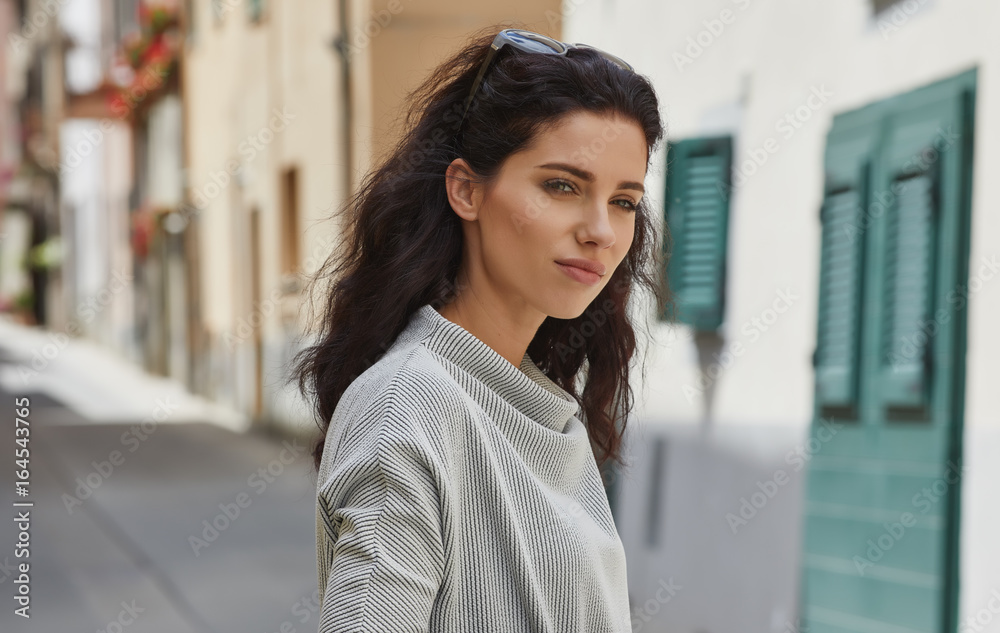 Elegant woman travel on street of italian city Elegant woman travel on street of italian city